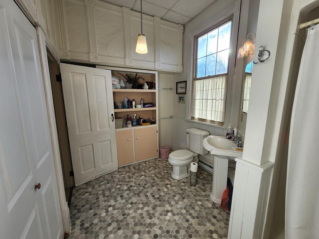 Lovely 3/4 Bath with Walk in Shower, Laundry Area 
