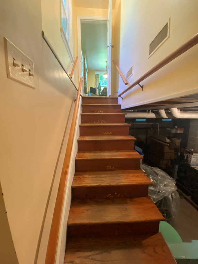 stairs from garage and storage area to kitchen